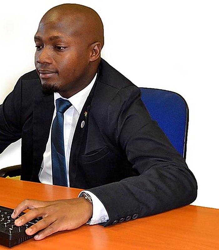 A KoboLender customer at work in his office